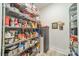 Walk-in pantry featuring floor to ceiling shelving for ample storage and organization at 2014 Newstyle Way, Tega Cay, SC 29708