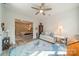 Cozy sitting room featuring a ceiling fan and seamlessly connecting to an inviting bedroom at 2014 Newstyle Way, Tega Cay, SC 29708