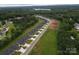 Aerial view of a new neighborhood with lush green spaces and a serene lake in the background at 3335 48Th Ne Ave # 13B, Hickory, NC 28601
