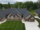 Charming single-Gathering home featuring a well-manicured lawn, brick facade, and a two-car garage at 3335 48Th Ne Ave # 13B, Hickory, NC 28601