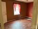 Bedroom featuring wood floors and a bright window at 1424 Montana Dr, Charlotte, NC 28216