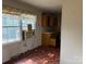 Retro kitchen featuring linoleum flooring, a retro countertop, and a bright window at 1424 Montana Dr, Charlotte, NC 28216