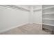 Large walk-in closet with built in shelving and hanging rods at 209 E Warfield Dr, Mooresville, NC 28115