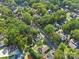 Aerial view of a residential neighborhood with lush trees at 301 S Washington St, Monroe, NC 28112