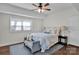 Bright bedroom with hardwood floors and a ceiling fan at 301 S Washington St, Monroe, NC 28112