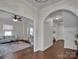 Bright entryway with hardwood floors, leading to living room and staircase at 301 S Washington St, Monroe, NC 28112