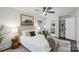 Bright bedroom with queen bed and en-suite bathroom access at 5731 Brookhaven Rd, Charlotte, NC 28210