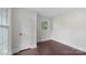 Bright bedroom with hardwood floors, a window, and a closet at 5731 Brookhaven Rd, Charlotte, NC 28210