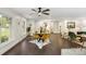 Bright dining area with hardwood floors and a glass-top table at 5731 Brookhaven Rd, Charlotte, NC 28210