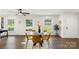 Bright dining area with hardwood floors and a glass-top table at 5731 Brookhaven Rd, Charlotte, NC 28210