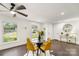 Bright dining area with hardwood floors and a glass-top table at 5731 Brookhaven Rd, Charlotte, NC 28210