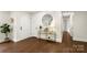 Stylish entryway with hardwood floors, gold accents, and large mirror at 5731 Brookhaven Rd, Charlotte, NC 28210