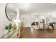 Elegant entryway with hardwood floors, large mirror, and console table at 5731 Brookhaven Rd, Charlotte, NC 28210