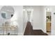 Light-filled hallway with dark hardwood floors at 5731 Brookhaven Rd, Charlotte, NC 28210