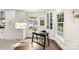 Home office with built-in shelving, desk, and natural light at 5731 Brookhaven Rd, Charlotte, NC 28210