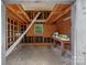 Unfinished workshop with wooden beams, shelves, and a workbench at 5731 Brookhaven Rd, Charlotte, NC 28210