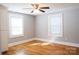 Bedroom with hardwood floors and two windows at 1350 8Th Nw St, Hickory, NC 28601