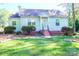 Charming light blue house with a well-manicured lawn at 1350 8Th Nw St, Hickory, NC 28601