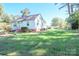 Front view of a charming light blue house with a yard at 1350 8Th Nw St, Hickory, NC 28601