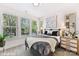 Bright bedroom with large windows, neutral decor, and comfortable furnishings at 2031 Belmont Terraces Ln # 6, Charlotte, NC 28205