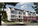 Attractive townhouse complex featuring modern architecture, well-kept landscaping, and ample parking at 2031 Belmont Terraces Ln # 6, Charlotte, NC 28205