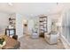 Cozy space with comfortable armchairs, shelving, and natural lighting at 2031 Belmont Terraces Ln # 6, Charlotte, NC 28205