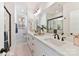 Elegant bathroom with dual sinks, a large mirror, and a walk-in shower at 2035 Belmont Terraces Ln # 5, Charlotte, NC 28205