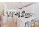 Bright kitchen boasts white cabinets, stainless steel appliances, a center island, and an open layout at 2035 Belmont Terraces Ln # 5, Charlotte, NC 28205
