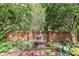 Serene garden with brick wall and tiered fountain at 4813 Cambridge Crescent Dr, Charlotte, NC 28226