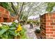 Private backyard oasis with brick walls and patio seating at 4813 Cambridge Crescent Dr, Charlotte, NC 28226