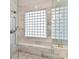 Spa-like shower with marble surround and built-in bench seat at 4813 Cambridge Crescent Dr, Charlotte, NC 28226