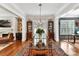 Bright dining room with glass table and hardwood floors at 4813 Cambridge Crescent Dr, Charlotte, NC 28226