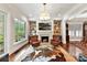 Gathering room with a fireplace and a view into the dining room at 4813 Cambridge Crescent Dr, Charlotte, NC 28226