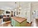 Kitchen with island, stainless steel appliances, and adjacent living area at 4813 Cambridge Crescent Dr, Charlotte, NC 28226