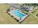 Community pool with adjacent clubhouse and ample parking at 50143 Robins Nest Ln, Lancaster, SC 29720