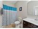 Clean bathroom with teal shower curtain and modern vanity at 50143 Robins Nest Ln, Lancaster, SC 29720