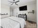 Bedroom with large bed, ceiling fan and built-in shelving at 50143 Robins Nest Ln, Lancaster, SC 29720