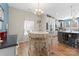 Bright dining area with round table and view into the kitchen at 50143 Robins Nest Ln, Lancaster, SC 29720