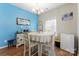 Charming dining room with round table and white chairs at 50143 Robins Nest Ln, Lancaster, SC 29720