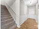 Bright entryway with hardwood floors and staircase at 50143 Robins Nest Ln, Lancaster, SC 29720