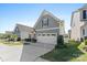 Two-story house with gray siding, a two-car garage and a well-maintained lawn at 50143 Robins Nest Ln, Lancaster, SC 29720