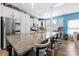 Modern kitchen with granite countertops, white cabinets, and a large island at 50143 Robins Nest Ln, Lancaster, SC 29720