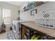 Laundry room with washer, dryer, and ample shelving at 50143 Robins Nest Ln, Lancaster, SC 29720