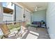 Relaxing screened porch with ceiling fan, seating area, and view of backyard at 50143 Robins Nest Ln, Lancaster, SC 29720