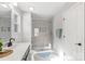 Bright bathroom with modern sink, glass-enclosed shower, and tiled floor at 7059 Duncan Acres Dr, Belmont, NC 28012