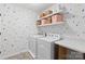 A cheerful laundry room with shelving and a modern washer and dryer at 7059 Duncan Acres Dr, Belmont, NC 28012