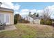 Backyard with shed and patio; partially fenced at 7206 Sandown Ct, Harrisburg, NC 28075