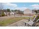 Backyard with wooden fence and patio seating area at 7206 Sandown Ct, Harrisburg, NC 28075