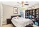 Bedroom with double bed, bookcase, and ceiling fan at 7206 Sandown Ct, Harrisburg, NC 28075