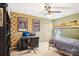 Bedroom with bunk beds, desk, and movie poster decor at 7206 Sandown Ct, Harrisburg, NC 28075